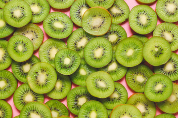 Many cut kiwi as background