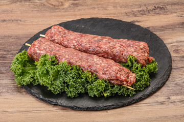 Raw minced beef kebab skewer