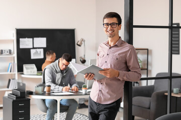 Fototapeta premium Portrait of male accountant in office