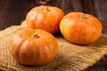 Pumpkins on the wooden table.