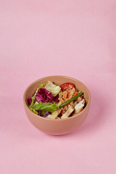 Rice And Vegetable Salad In A Deep Plate Isolated On A Solid Background