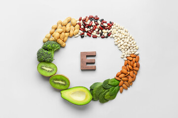 Frame made of healthy products rich in vitamin E on white background - obrazy, fototapety, plakaty