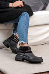 woman legs wearing brown black leather fashion shoes with casual clothes with very stylish bottom