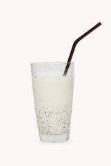 fresh kiwi green smoothie milkshake prepared with milk. Presented in a high glass with straw isolated on white background