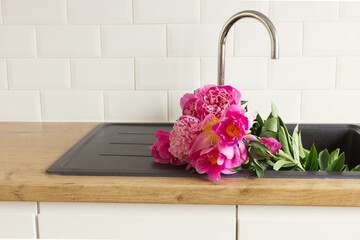 Floral composition with peonies. Selective focus, blurred background. Spring flowers. Spring background. A place for your text.