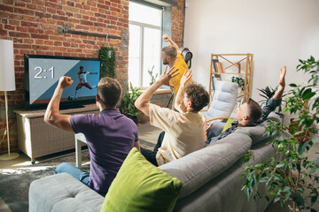 Group of friends watching TV, sport match together. Concept of friendship, leisure activity, emotions