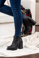 woman legs wearing brown black leather fashion shoes with casual clothes with very stylish bottom