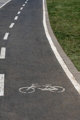 Fototapeta premium bike path, bicycle lane, side of the grass field,