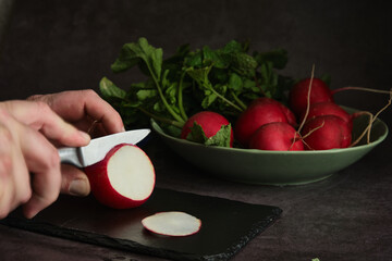 sliced radish on a dark background