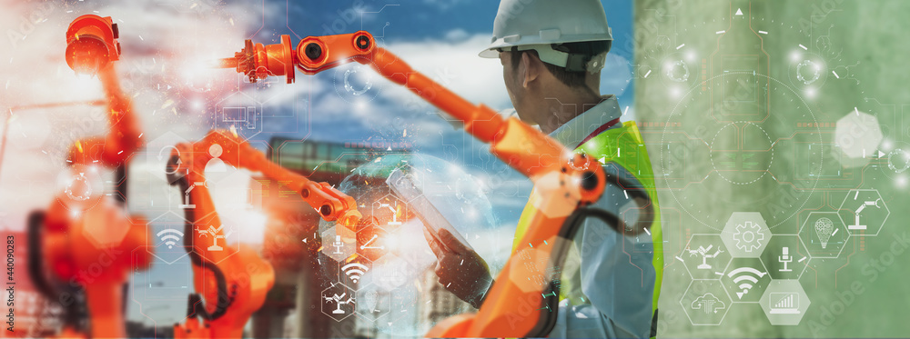 Wall mural industry engineer construction,using smart tablet,control automation robot arm machine intelligence 