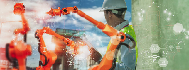 Industry engineer construction,using smart tablet,control automation robot arm machine intelligence operation construction site,concept business industry 4.0,Artificial intelligence or AI,5G network