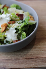 caesar salad appetizer on wooden background