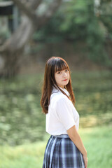 Fototapeta premium beautiful asian japanese school girl uniform looking at park outdoor
