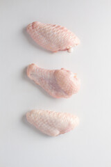 Fototapeta na wymiar raw chicken wings white background. flat lay