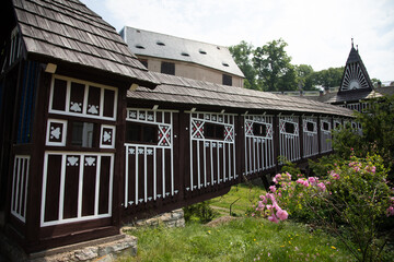 Wonderful covered wooden bridge by Dusan Jurkovic in Italian garden, baroque park in sunny summer...