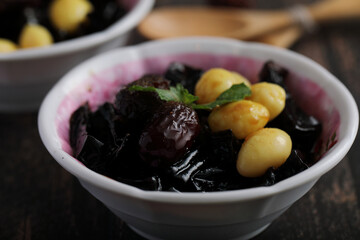 Local Thai dessert glass jelly isolated in wood background