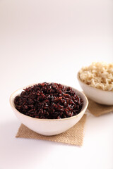 Organic boiled brown rice on bowl isolated in white background