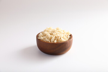 Organic boiled brown rice on bowl in close up