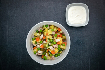 Delicious salads on a dark table
