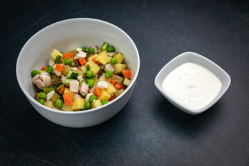 Delicious salads on a dark table
