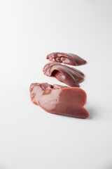 Raw chicken liver, white background, 3 pieces