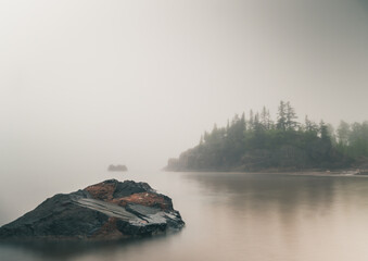 Mesmerizing shot of a fog layer over the lake