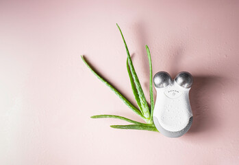 Facial massager with microcurrent attachment. Using electrical impulses in cosmetology concept. Professional home care.