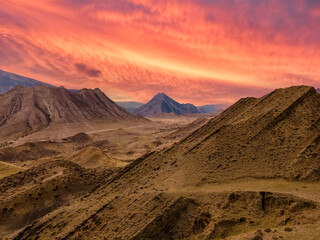 Fototapeta na wymiar Mountain landscape against the backdrop of a fiery red sunset