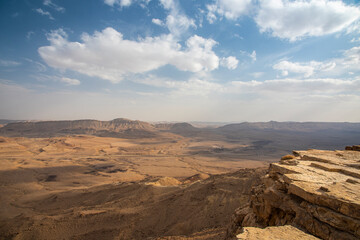 Ramon Crater Makhtesh Ramon, the largest in the world, as seen from the high rocky cliff edge surrounding it from the north, Ramon Nature reserve, Mitzpe Ramon, Negev desert, Israel. High quality