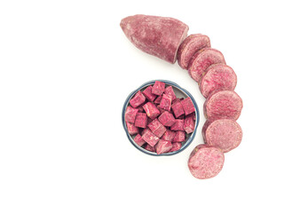 Purple yams or purple sweet potatoes isolated on white background. Side view. Vegan fruit and healthy fruits concept