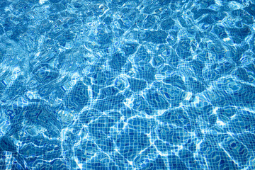 Fototapeta na wymiar Wavy water surface of swimming pool. background. summer concept. copy space.