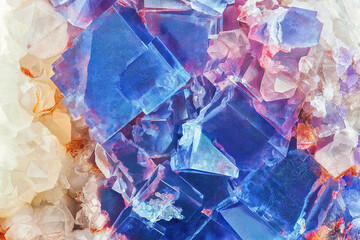 Amazing colorful macro closeup of blue or cobalt rare fluorite mineral specimen isolated as a background. Natural mineral gem stone (fluorspar). Natural cubic texture - Fluorite crystals detail - obrazy, fototapety, plakaty