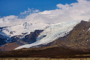 Beautiful blue iced glaciers retreating back into the mountains on the south east of Iceland
