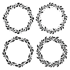 Set of 4 hand drawn spring wreaths isolated on white background, vector. Silhouette circle of leaves. Doodle style.Collection of floral frames.