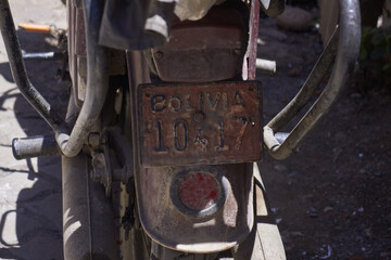 Old car license plate of a disused motorcycle