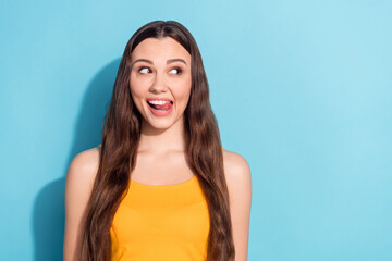 Fototapeta premium Photo portrait dreamy curious girl looking blank space isolated pastel blue color background