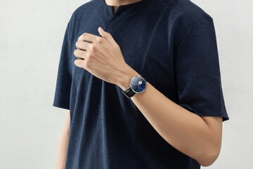 Young men wearing wrist watch in casual clothing lifestyle