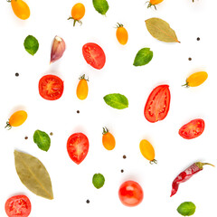 Cherry tomatoes and spices isolated on white .