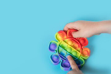 Rainbow Pop it fidget toy on a empty copy space background