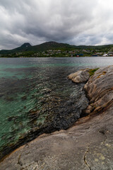 bay in the fjord, clear water, rocky coast