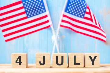 Fourth of July text on United States of America flag background. USA holiday of Independence and celebration concepts
