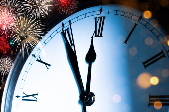 Clock About To Strike Midnight On New Years Eve With Fireworks