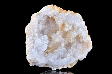 Pure Clear Crystal Quartz geode with crystalline druze or geode isolated on black background. Macro...