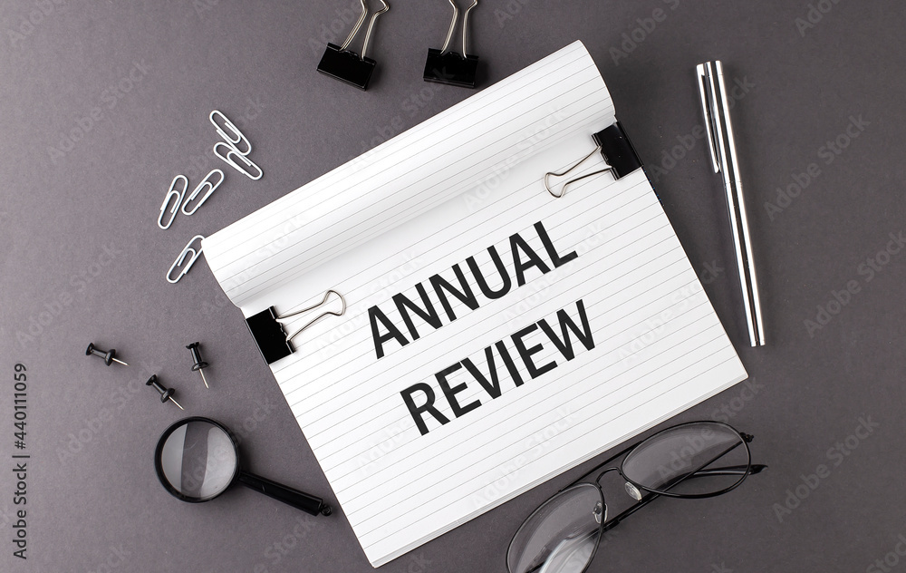 Poster notebook with tools and notes with text annual review , business concept