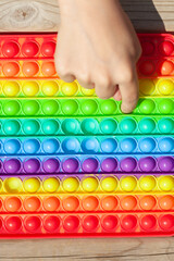 Baby fingers and antistress toy - popit, simple dimple