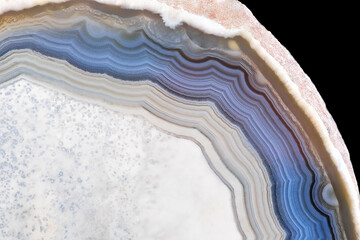Amazing White Blue Agate Crystal cross section isolated on black background. Natural rough agate crystal surface, Abstract structure slice mineral stone macro closeup