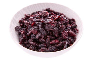 Cranberry dry berry in a white dish on a white background.Isolated products and items