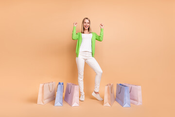 Full length body size view of attractive cheerful girl celebrating new bargain having fun isolated...