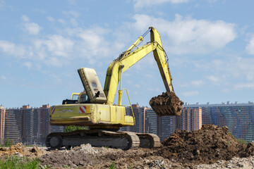 Construction equipment in the background of the city