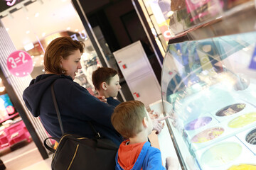 Mother with sons choosing ice cream